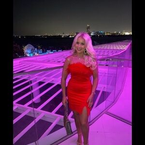 Karen Millen Red feather mini dress with small slit. Worn once, size 4